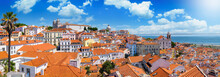 Panoramic View Of The Beautiful Skyline Of Lisbon, Portugal, With Red Roofed, Colorful Houses In The Alfama District During A Sunny Day