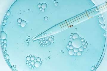 laboratory petri dish with liquid and pipette. abstract scientific research concept.