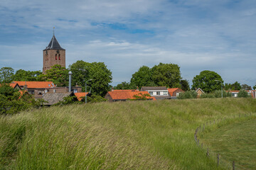 Church in dutch village Oost Souburg, Province Zeeland, seen from ancient Circular rampart which dates back to 9th century 