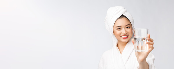 Wall Mural - Healthy young beautiful woman drinking water, beauty face natural makeup, isolated over white background.