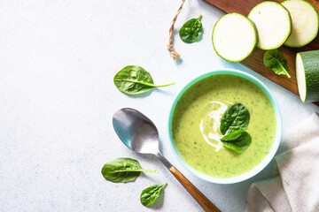 Wall Mural - Green soup. Zucchini, spinach cream soup with cream.