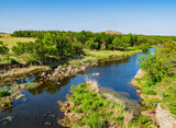 Fototapeta Natura - Sunny view of the landscape around Wichita Mountains Wildlife Refuge