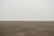 Beach sand and foggy sky abstract