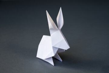 Wall Mural - white paper rabbit origami isolated on a grey background