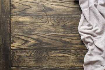 Sand color tablecloth on oak wooden table top view with copy space