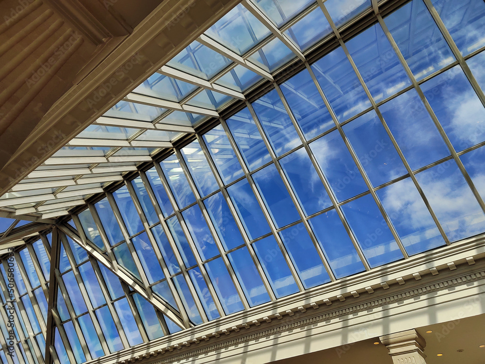 Ceiling Sun Window Skylight or glass sunroof ceiling of a building. Window in commercial ...