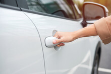 Hand Holding Smart Car Handle And Opening A Door. Transport, Travel, Service And Car Rental Concept