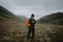 Male Hiker With Backpack In Remote Landscape, Great End, Lake District National Park, England

