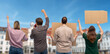 © Syda Productions - feminism and human rights concept - group of people with posters protesting on demonstration and showing middle finger over city street in europe background
