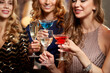 © Syda Productions - celebration, bachelorette party and holidays concept - group of happy women drinking champagne and cocktails at night club