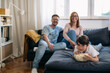 © cherryandbees - family at home, watching television and eating popcorn