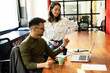© JustLife - Businessman and businesswoman on coffee break. Colleagues enjoy in fresh coffee