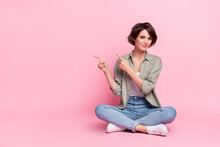 Full Size Photo Of Pretty Lady Sit Floor Point Empty Space Demonstrate Promotion Isolated Pastel Color Background