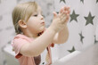 © paralisart - Little toddler girl in bathroom washing hands. Healthy, Child Hygiene concept.