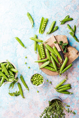 Wall Mural - fresh green peas on old cracked table