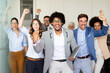© NDABCREATIVITY - Success group of multiethnic entrepreneurs and business people achieving goals in corporate office