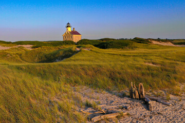 amazing late afternoon summer photo of the north lighthouse on block island, rhode island.