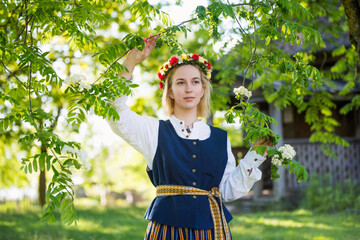 Wall Mural - Latvian woman in traditional clothing. Ligo folk.