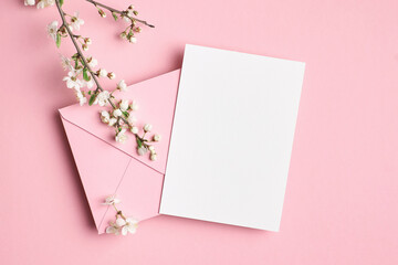 Wall Mural - Blank invitation card mockup with envelope and flowers