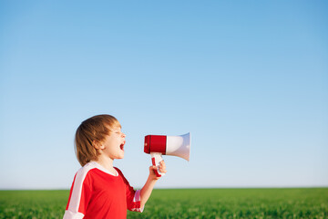 Wall Mural - Child is pretending to be a soccer player