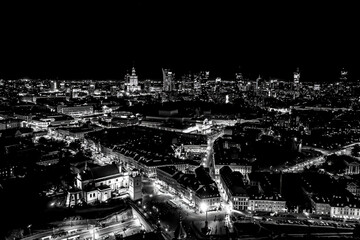 Wall Mural - Black and white Aerial view of old buildings, castles and a church in the old city of Warsaw. Cityscape of old buildings and architecture in the old town in Warsaw. Night time