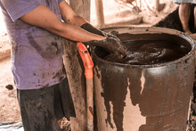 Nicaraguan Laborer Washing His Hands During His Work Making Mud Bricks In A Traditional Workshop