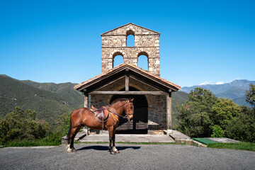 Brown spanish house in S. Miguel hermitage with Picos de Europa in the background. Cantabria. Spain