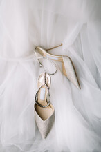 Stylish Wedding Shoes With Veil On A Background 
Wedding Flat Lay