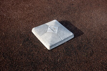 Top Down, Close Up View Of A Base On A Clean Baseball Field On A Bright, Sunny Day