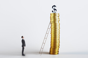 Save money and investment growth concept with businessman standing in front of ladder leaning against high golden coins stack and dollar sign on top