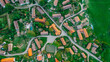 Aerial view of a small village.Top view of traditional housing estate in Czech. Looking straight down with a satellite image style.Houses from above, real estate concept.Country road urban scene