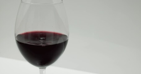 Wall Mural - Red wine in a glass.