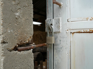 key hanging on metal sliding door.