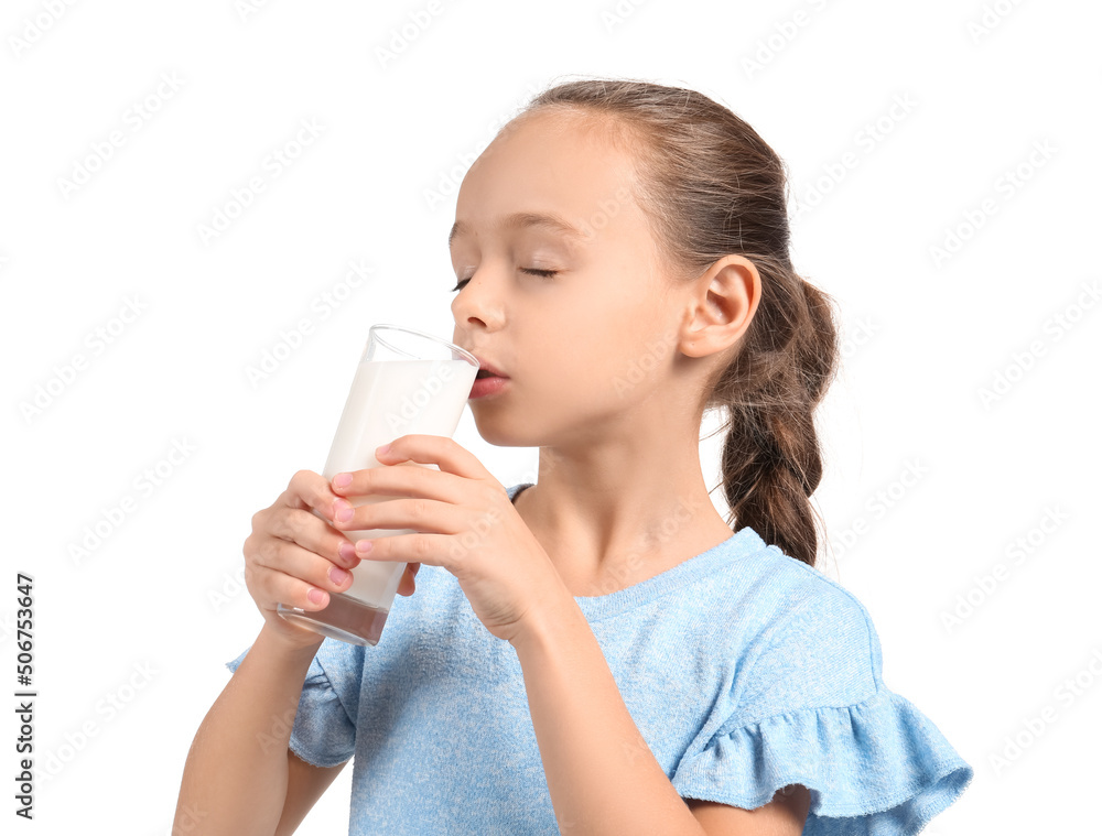 Little girl drinking milk on white background
