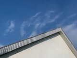 Fototapeta Na sufit - Corner roof of building with blue sky background