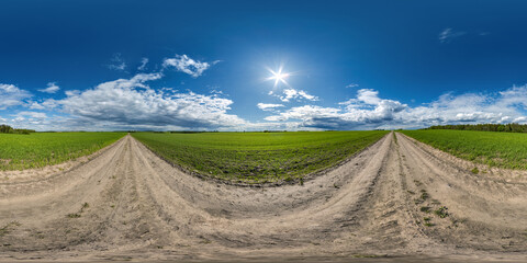 Wall Mural - full seamless spherical hdri 360 panorama view on no traffic gravel road among fields in summer day with awesome clouds before storm in equirectangular projection, ready for VR AR