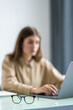 © dianagrytsku - Experienced businesswoman reading publication via laptop making research for planning startup at desktop