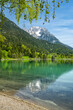 Wilder Kaiser mountain range reflected in idyllic Hintersteiner See, Scheffau, Tyrol, Austria, Europe