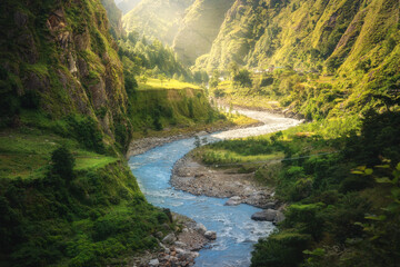 Wall Mural - colorful landscape with high himalayan mountains, beautiful curving river, green forest, grass, yell