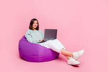 Full Size Profile Side Photo Of Youth Woman Sit Chair Manager Use Laptop Typing Isolated Over Pink Color Background