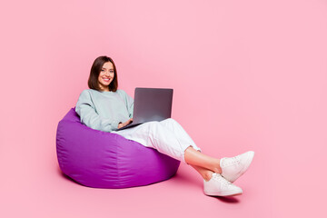 full size profile side photo of youth woman sit chair manager use laptop typing isolated over pink c