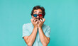 © kues1 - young adult hispanic crazy man with 3d cinema glasses