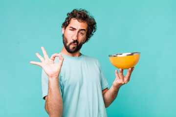 Sticker - young adult hispanic crazy man holding an empty bowl