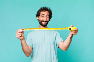 young adult hispanic crazy man with a medition meter