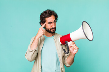 Wall Mural - young adult hispanic crazy man with a megaphone