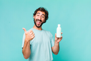 Wall Mural - young adult hispanic crazy man with a milk bottle