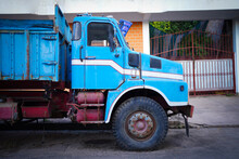 Old Blue Truck Parking On The Street.