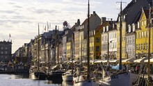 4K Timelapse Sequence Of Copenhagen, Denmark - The Nyhavn Waterfront Canal And Entertainment District During A Sunny Day