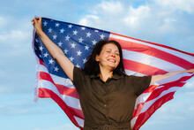 Young Beautiful Woman Holding USA Flag