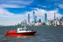 Fire Department Boat Against Manhattan